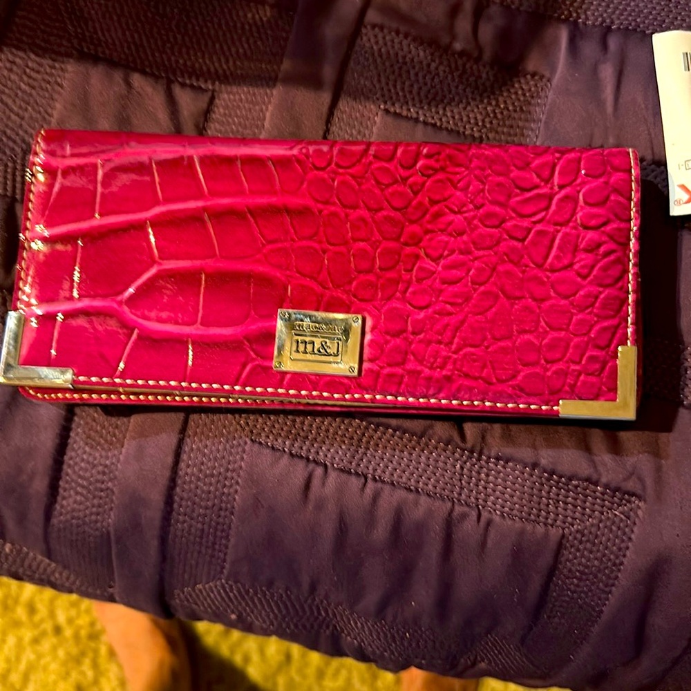 M&j wallet 8 1/2 inches wide 4 inches high a quarter inch with